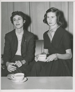 Unidentified women seated with coffees