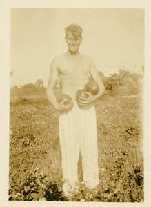 Leon M. Smith standing in field