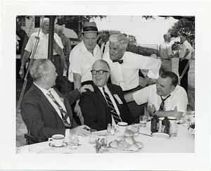 Mayor John F. Collins and others attending an outdoor luncheon