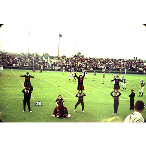 Cheerleaders at football game versus University of Rhode Island