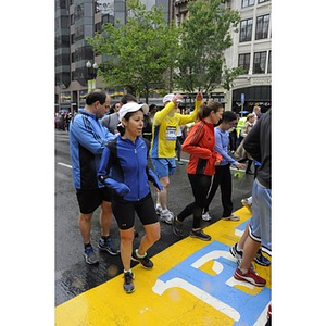 Numerous "One Run" participants touch the Copley Square finish line