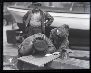 John P. Johnson ("Armless Johnson"), signing an autograph for a young boy