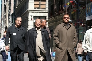 Jesse Jackson (buttoned coat) and Al Sharpton leading the march opposing the war in Iraq