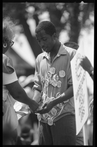 Young man hawking buttons marking the 25th Anniversary of the March on Washington