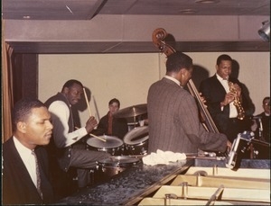 John Coltrane (saxophone), Jimmy Garrison (double bass), Elvin Jones (drums), and McCoy Tyner (piano) performing at the Jazz Workshop