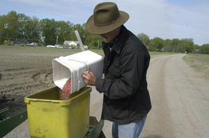 Lazy Acres Farm (Zuchowski Farm): Allan Zuchowski loading corn seed into his planter