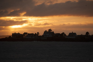 Houses on a point of land at sunset