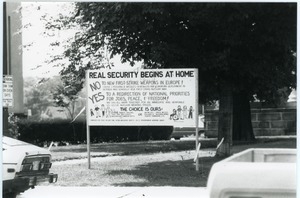 ' Real security begins at home': antinuclear weapons sign posted on Main Street, Northampton