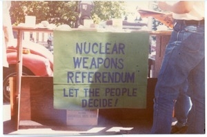 Sign supporting the nuclear referendum hung from a makeshift table: 'Nuclear weapons referendum: Let the people decide'