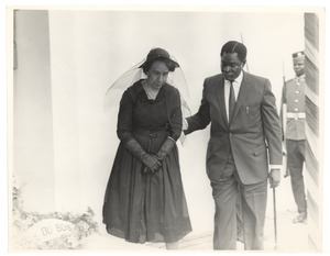 Unidentified minister of the Ghanaian government escorting Shirley Graham Du Bois at the state funeral for W. E. B. Du Bois