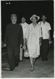 Shirley Graham Du Bois walking with two unidentified men and one woman