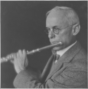 Frank A. Waugh playing a flute