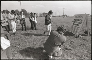 Antiwar demonstration at Fort Dix, N.J.: reporters and photographers inspecting sign prohibiting unauthorized demonstrations
