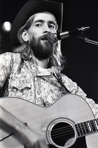 New Riders of the Purple Sage opening for the Grateful Dead at Sargent Gym, Boston University: John 'Marmaduke' Dawson playing acoustic guitar and singing