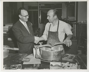 Senator Potter shaking hands with client in workshop at Institute Day