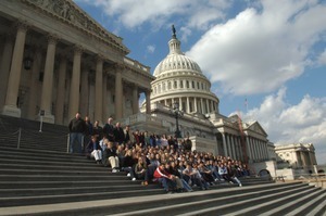 Congressman John W. Olver (rear row, 4th from left) with visiting group, posed on the steps of the United States Capitol building