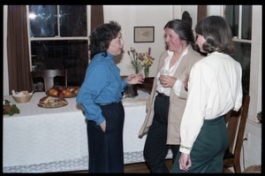Women talking in the kitchen, at the book party for Robert H. Abel