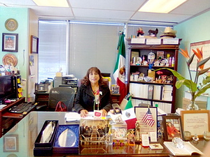 A Photograph of Elia Chinò Sitting at a Desk