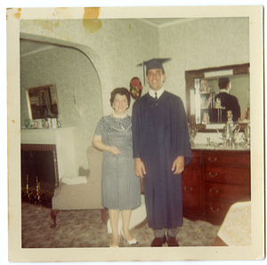 Robert Mello, in graduation gown, with his mother
