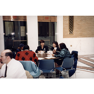 Female audience members at a town hall meeting