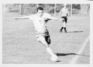 A Suffolk University men's soccer player prepares to kick the ball