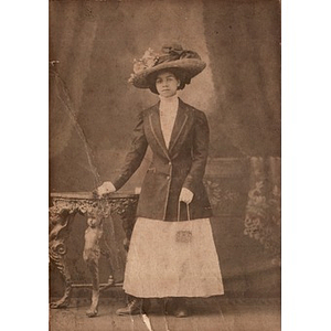 An African American woman wearing an ornate hat
