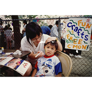 Face painting at the Recreation Day fair