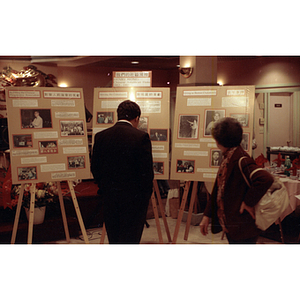 Guests view the Henry Wong memorial display at the Chinese Progressive Association's 15th Anniversary Celebration