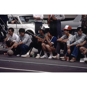 Spectators watching a volleyball game