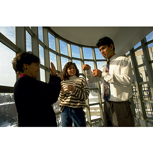 Students and teacher using sign language