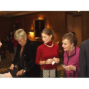 Three women arriving at gala dinner for John Hatsopoulos