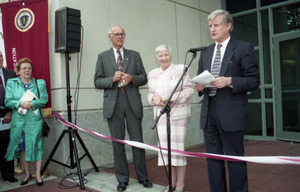 Dedication ceremonies for the Conte Polymer Center: Chancellor David K. Scott addressing the crowd, with Corinne Conte and John Olver