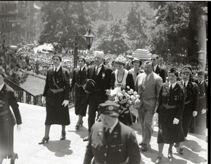 Amelia Earhart reception: Earhart ascending the steps at the Massachusetts State House, acting Mayor Edward M. Gallagher to her right