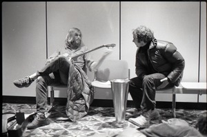 Richard Safft talking to person waiting at JFK airport with guitar