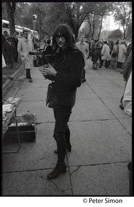 Woman with a 16mm Bolex camera, covering the George Wallace rally on Boston Common