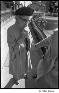 Jack Kerouac's funeral: older woman wearing hat outside church
