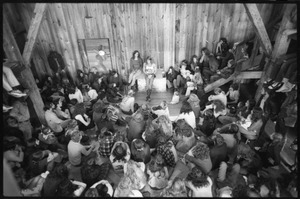 Michael Metelica addressing a crowd of commune members at a meeting inside the Brotherhood of the Spirit dormitory, Warwick, Mass. (view from above, front)