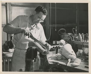 A craftsman works in the artificial limb and brace shop