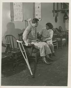 Arthur Fossa seated wearing leg braces