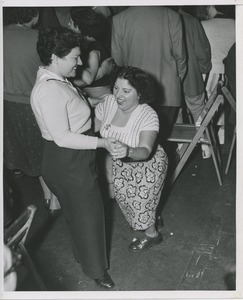 Two women dancing on boat ride