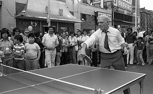 Mayor Kevin White plays table tennis at the 1979 August Moon Festival