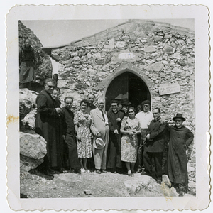 Group outside of a stone building