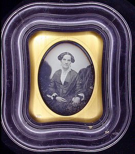 Half-length portrait of an unidentified seated adult female