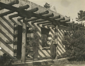 Cary C. Marshall in front of the Pueblo of the Seven Fires