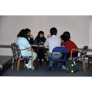Inquilinos Boricuas en Acción staff gathered around a table during a meeting or retreat.