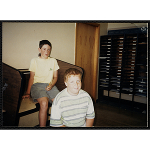 Two boys sitting in a classroom