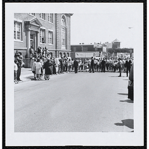 Boys line-up for the start of the Roxbury Road Race as they take instruction from a man