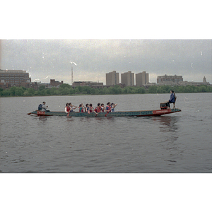 Dragon boat race team paddles in the Charles River