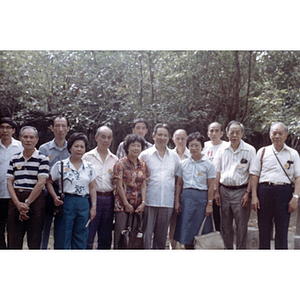 Men and women pose together in a Chinese forest