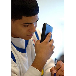 Danny Vazquez holds a calculator in class